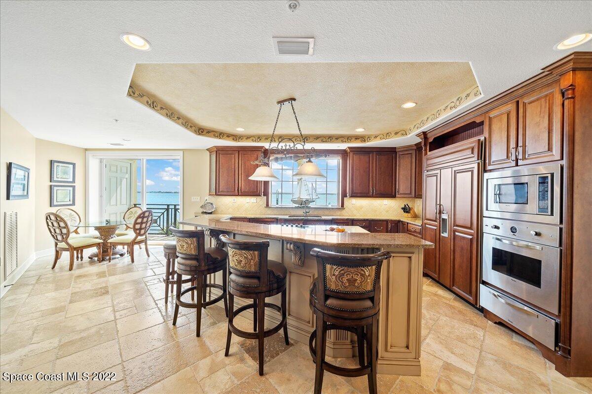 2300 Front Street, Unit 200 Melbourne, FL 32901 - Photo 17 of 92 a kitchen with stainless steel appliances granite countertop a stove and a refrigerator