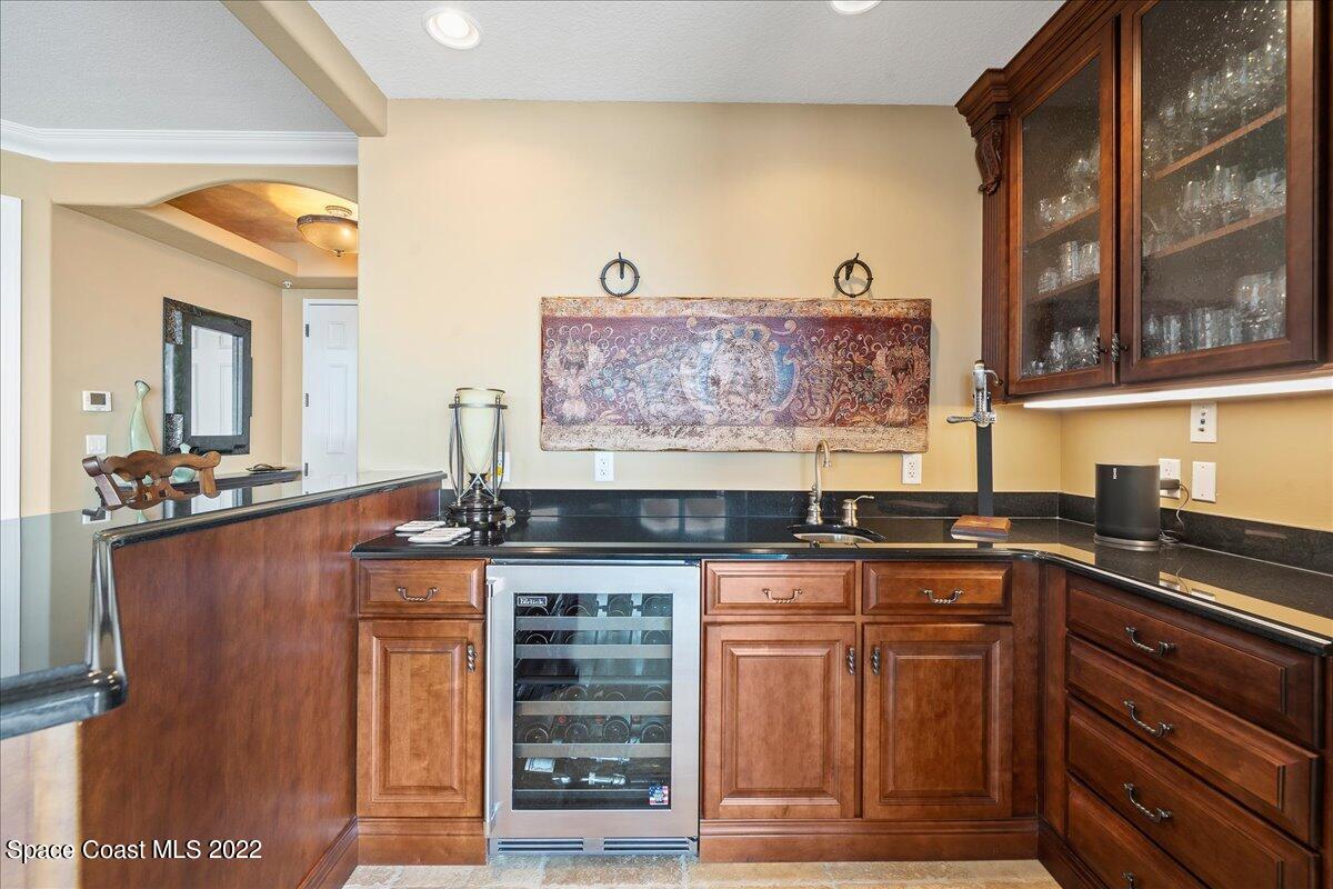 2300 Front Street, Unit 200 Melbourne, FL 32901 - Photo 27 of 92 a kitchen with stainless steel appliances granite countertop a stove and cabinets