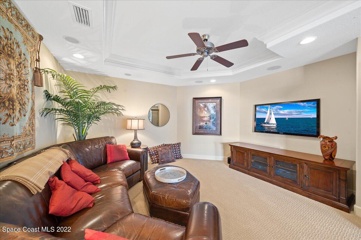 2300 Front Street, Unit 200 Melbourne, FL 32901 - Photo 32 of 92 a living room with furniture and a flat screen tv