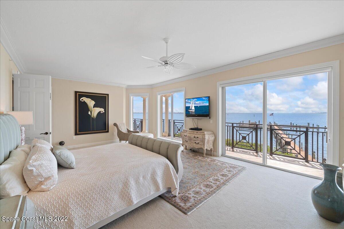 2300 Front Street, Unit 200 Melbourne, FL 32901 - Photo 37 of 92 a bedroom with a large bed and a large window