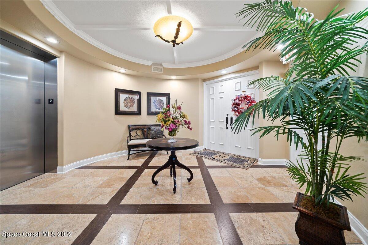 2300 Front Street, Unit 200 Melbourne, FL 32901 - Photo 6 of 92 a view of a livingroom with furniture and a potted plant