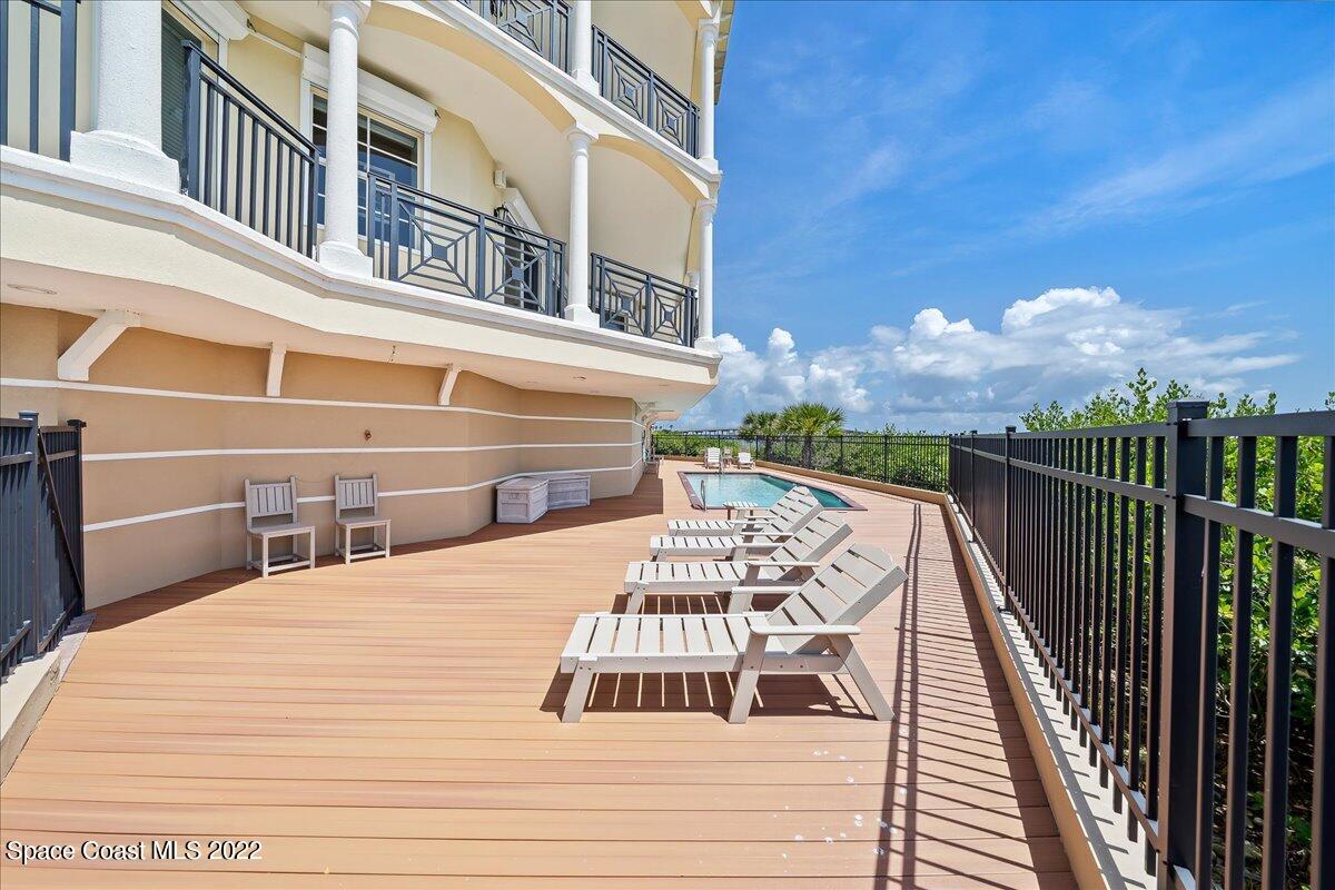 2300 Front Street, Unit 200 Melbourne, FL 32901 - Photo 84 of 92 a view of a balcony with wooden floor and fence