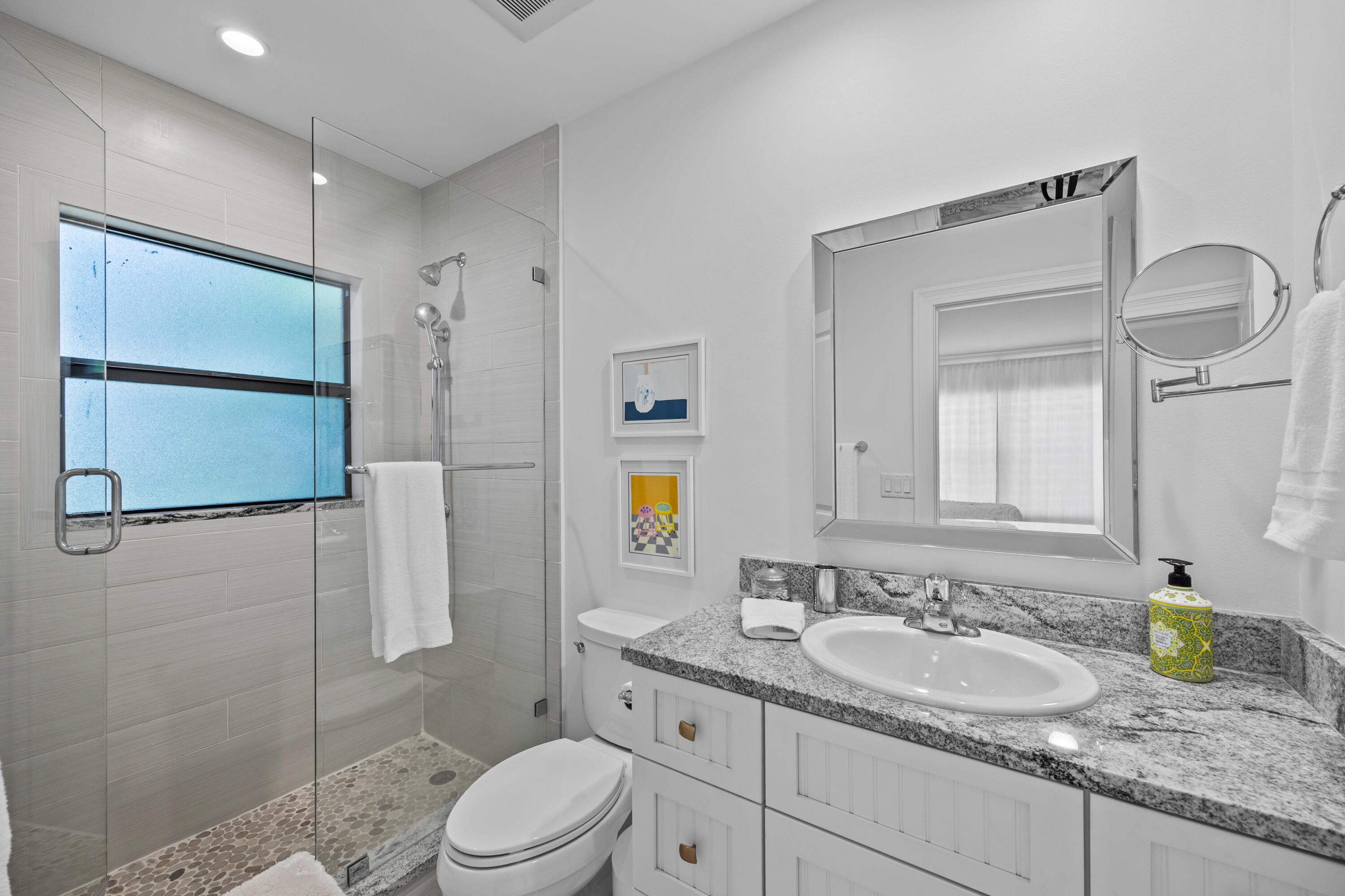 13254 Polo Club Road, Unit C204 Wellington, FL 33414 - Photo 20 of 29 a bathroom with a granite countertop sink a toilet and shower