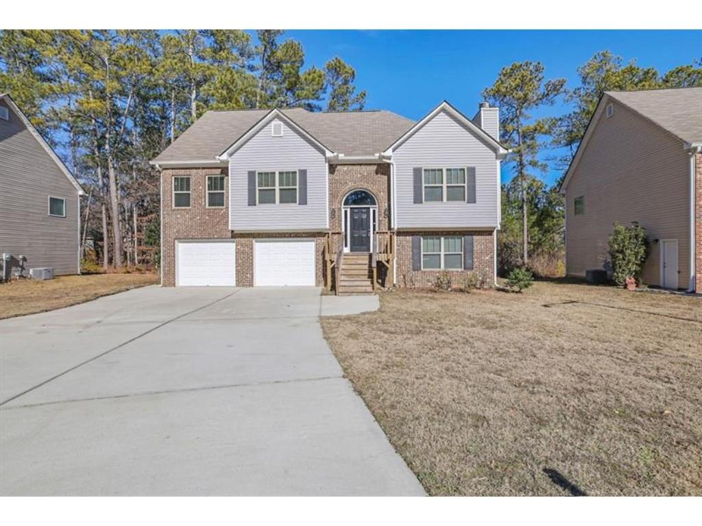 2686 Caleb James Road Marietta, GA 30064 - Photo 1 of 1 a front view of a house with a yard