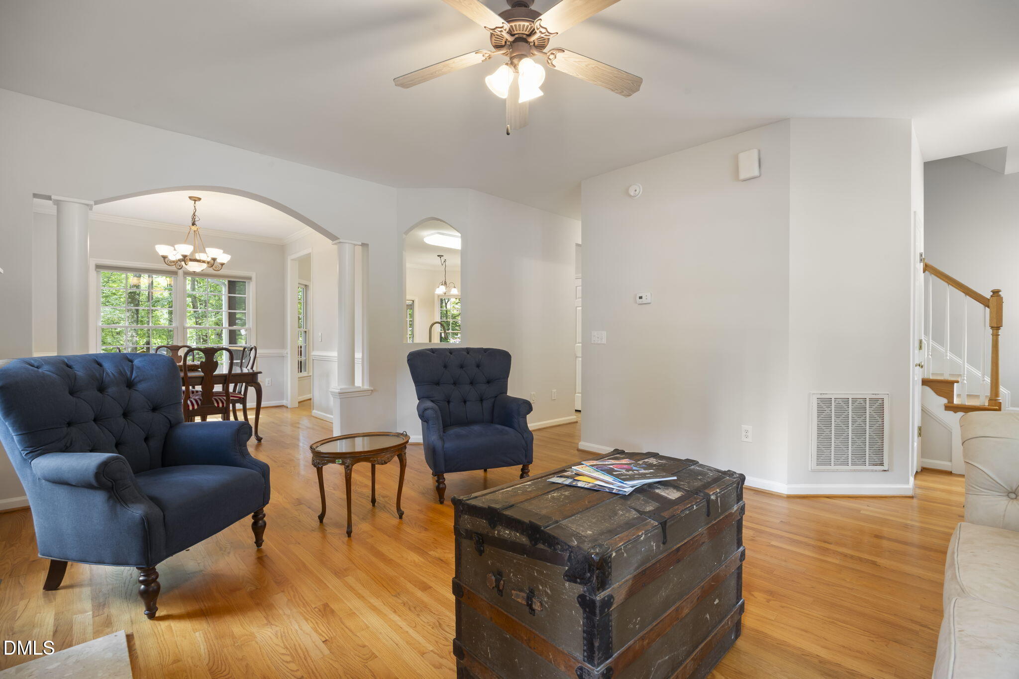 1008 Scotts Ridge Trail Apex, NC 27502 - Photo 16 of 57 a living room with furniture and a chandelier