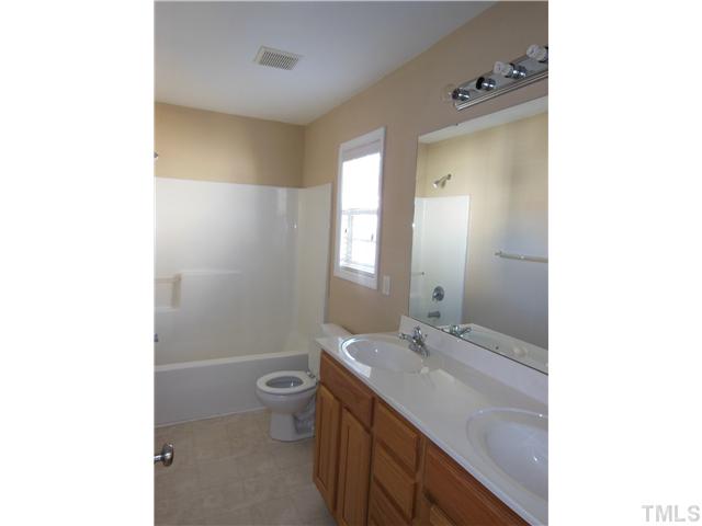 8516 Tierra Del Sol Way Raleigh, NC 27616 - Photo 19 of 20 Jack and Jill bathroom connected to both secondary bedrooms equipped with dual vanities!