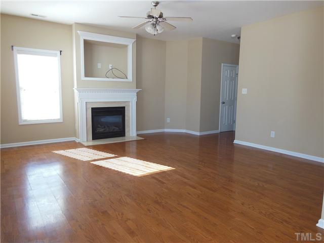 8516 Tierra Del Sol Way Raleigh, NC 27616 - Photo 5 of 20 Charming living room with lots of natural light. Fireplace and built in entertainment center give this room lots of character.