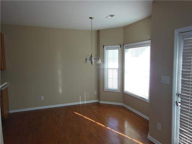 8516 Tierra Del Sol Way Raleigh, NC 27616 - Photo 6 of 20 Dining room has bay window and separated the huge living room from the kitchen.