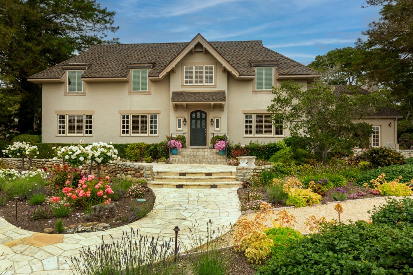 3929 Ronda Road Pebble Beach, CA 93953 - Photo 3 of 88 a front view of a house with a garden