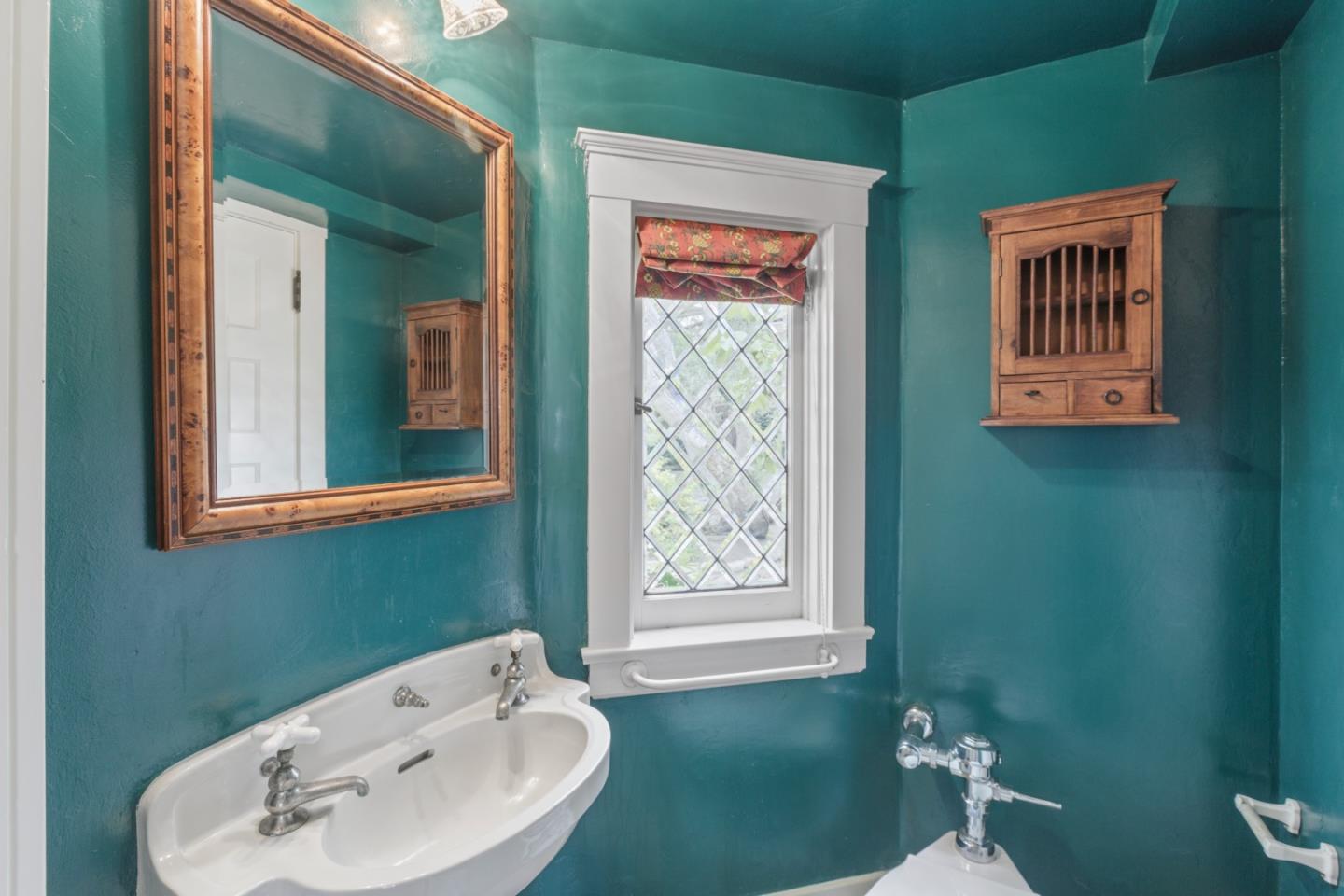 3929 Ronda Road Pebble Beach, CA 93953 - Photo 35 of 88 a bathroom with a sink and a mirror