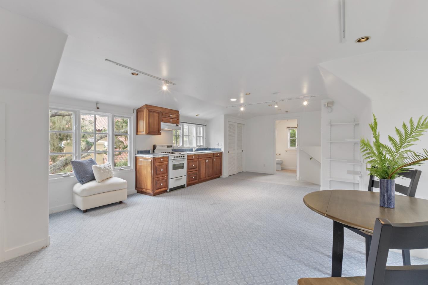3929 Ronda Road Pebble Beach, CA 93953 - Photo 56 of 88 a living room with furniture kitchen view and a potted plant