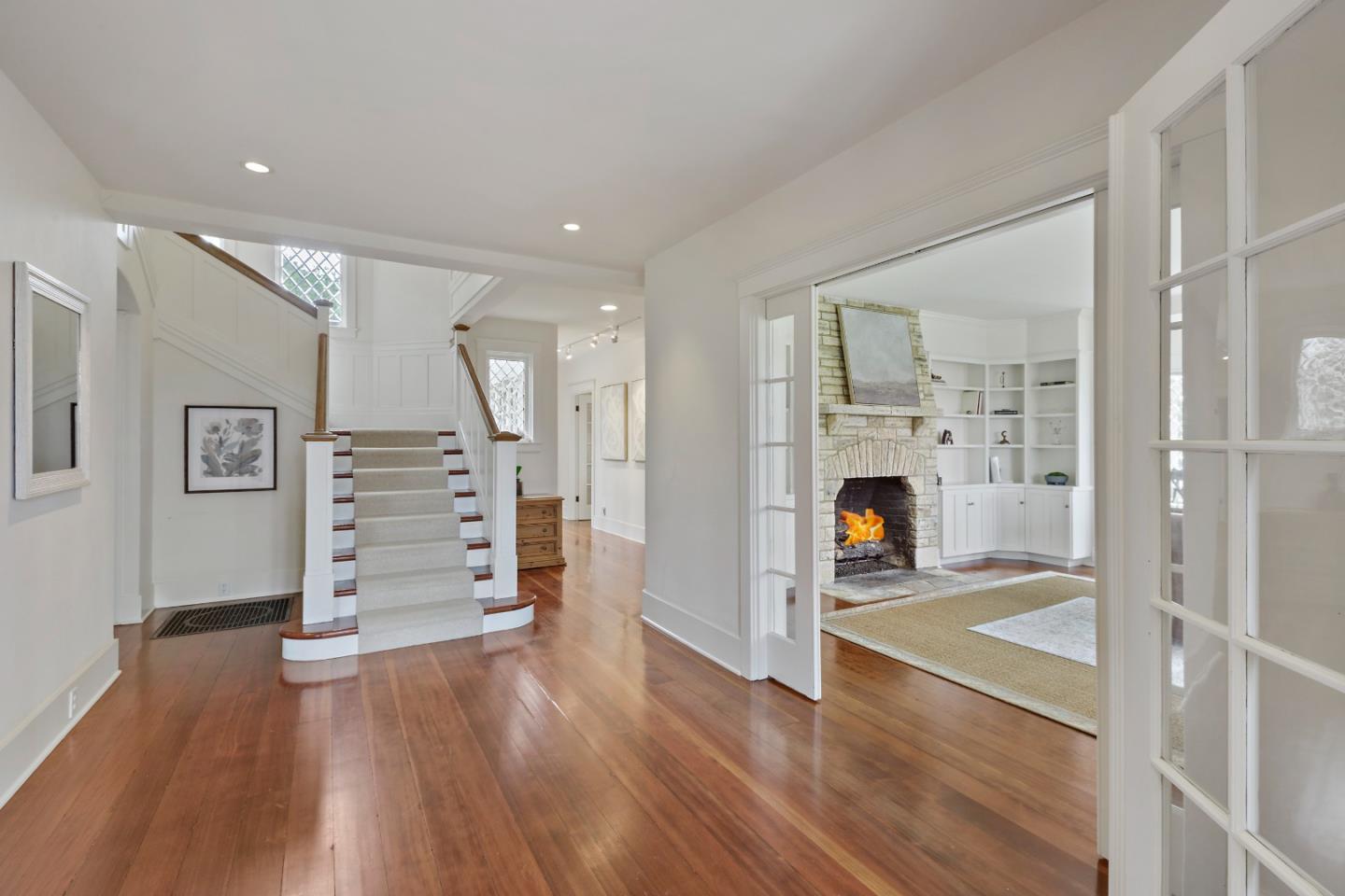 3929 Ronda Road Pebble Beach, CA 93953 - Photo 7 of 88 wooden floor and an empty room with wooden floor and fireplace