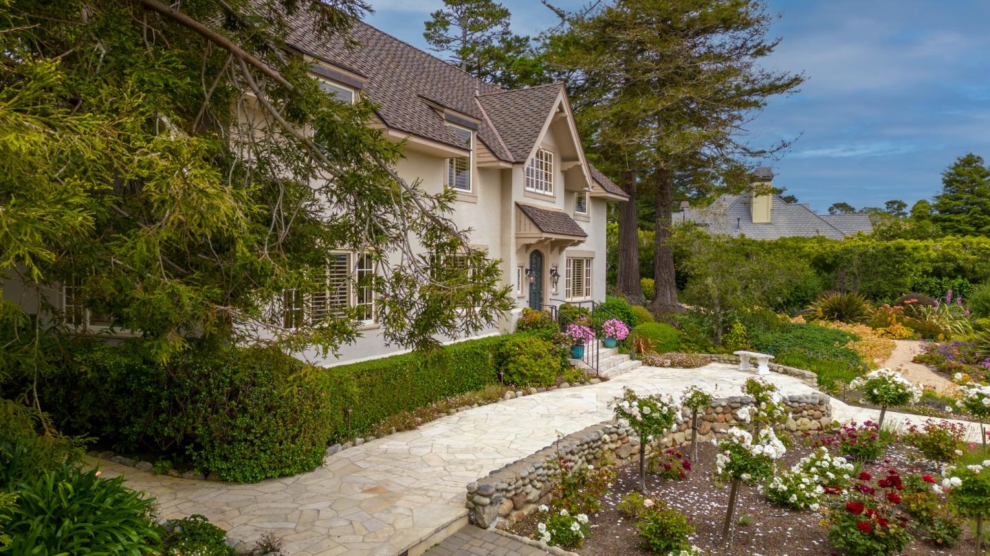 3929 Ronda Road Pebble Beach, CA 93953 - Photo 86 of 88 a view of a white house with a yard and garden