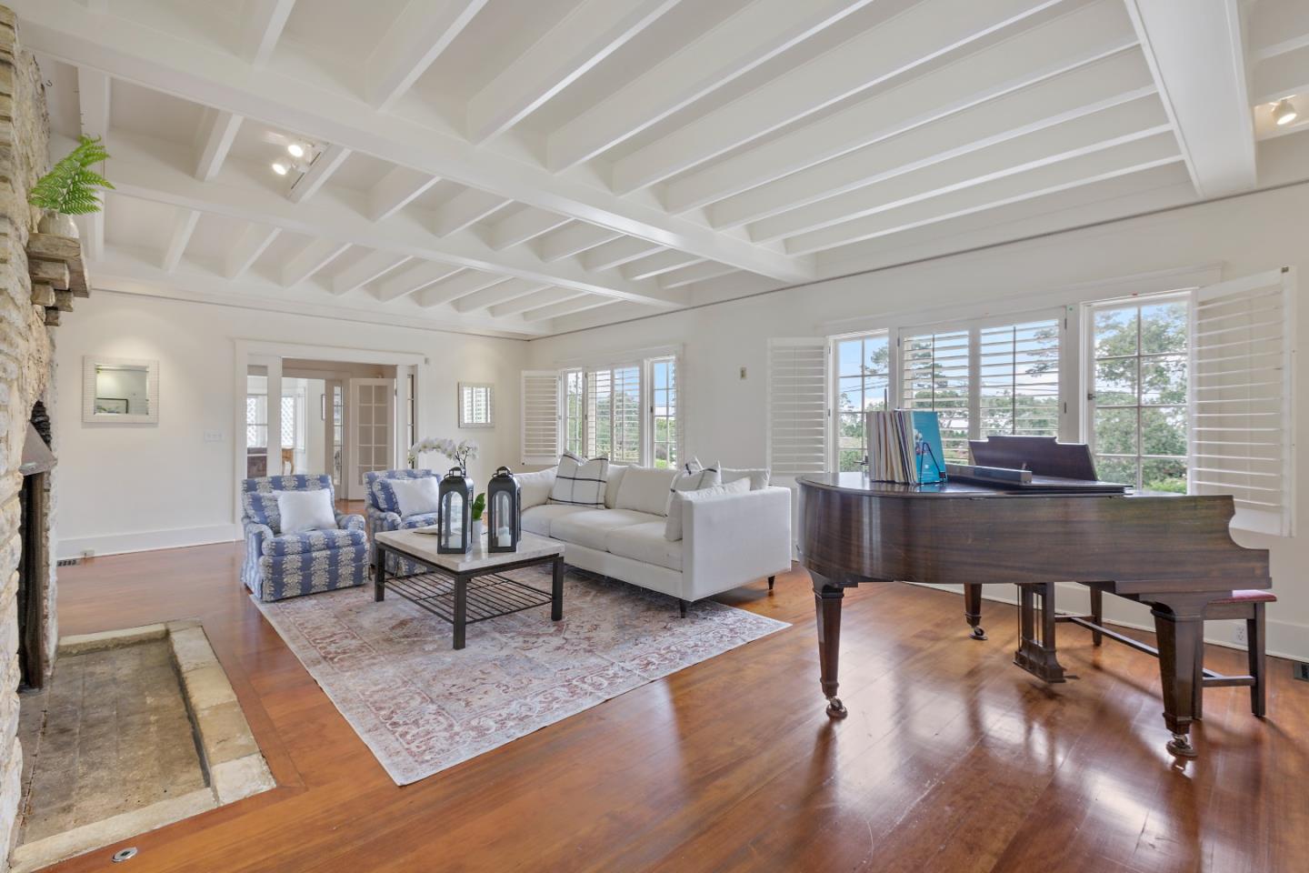 3929 Ronda Road Pebble Beach, CA 93953 - Photo 9 of 88 a living room with furniture a wooden floor and next to a window