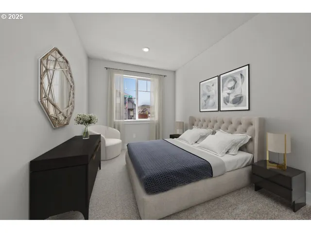 a bedroom with a bed and a painting on the wall