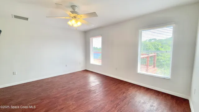 a spacious bathroom with a double vanity sink and mirror