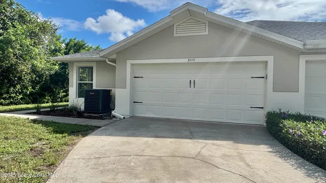 a house view with a backyard space