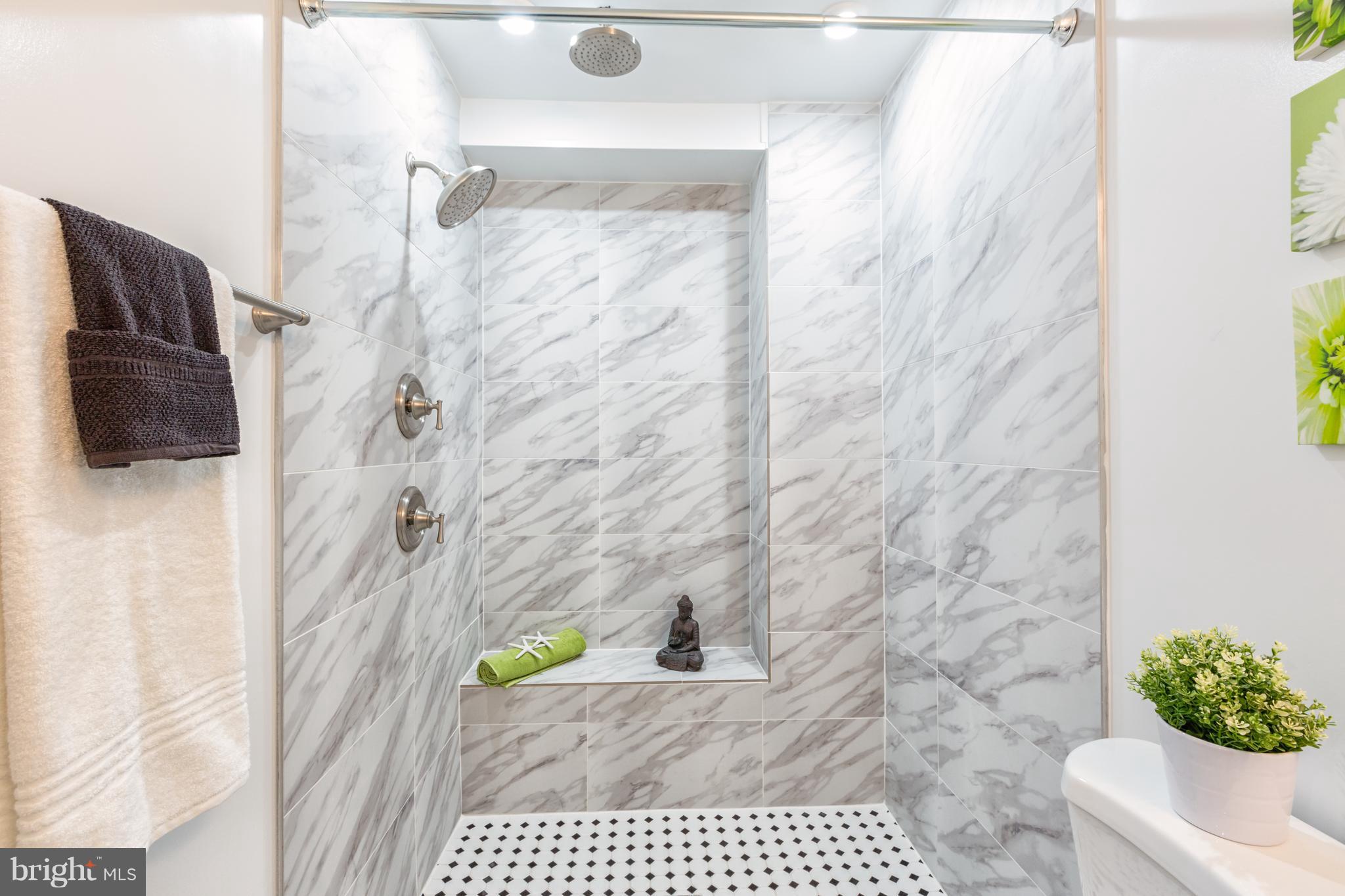 718 Jackson Street Northeast, Unit 1 Washington, DC 20017 - Photo 12 of 26 a bathroom with a shower