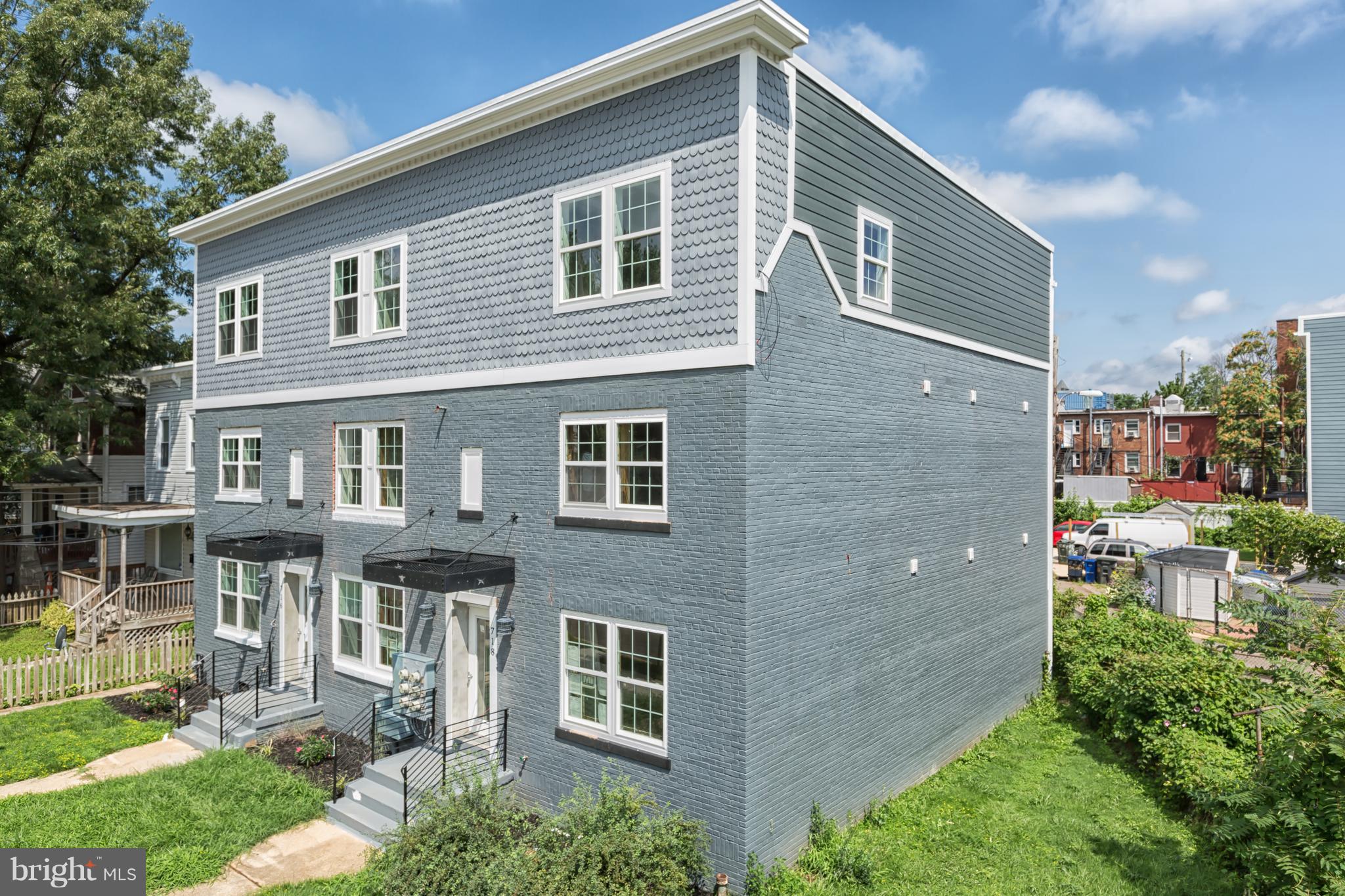 718 Jackson Street Northeast, Unit 1 Washington, DC 20017 - Photo 20 of 26 a front view of a house with garden