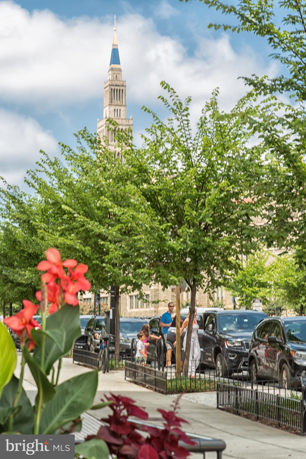 718 Jackson Street Northeast, Unit 1 Washington, DC 20017 - Photo 25 of 26 a front view of a house with a yard