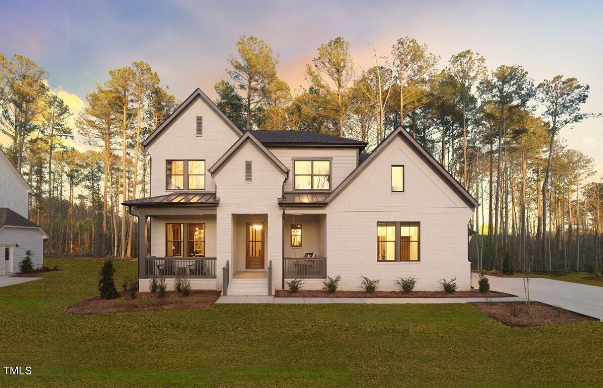 7608 Hasentree Way, Unit 457 Wake Forest, NC 27587 - Photo 1 of 50 a front view of a house with a yard