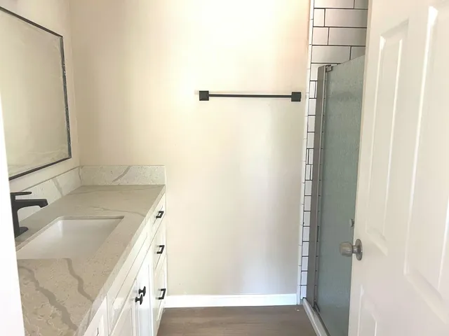 a bathroom with a bathtub and a shower