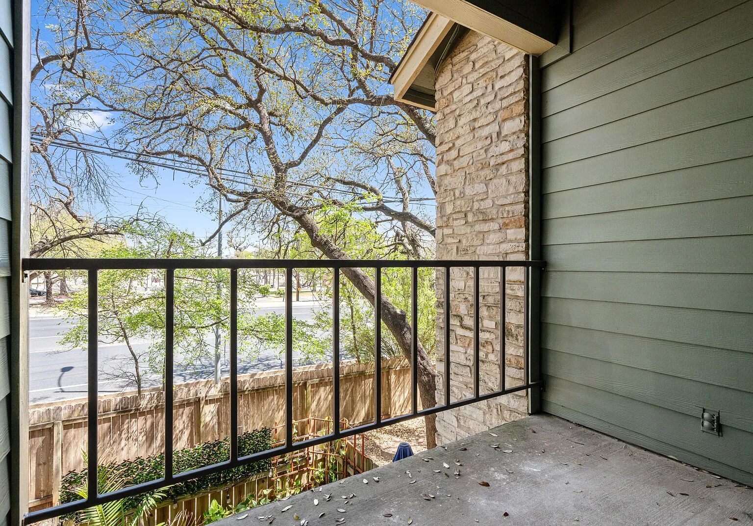 11970 Jollyville Road, Unit 202 Austin, TX 78759 - Photo 21 of 25 An inviting balcony offers treetop views and neighborhood vistas, ideal for relaxed outdoor living.