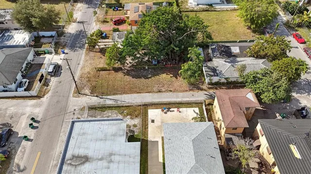 an aerial view of a residential apartment building with a yard