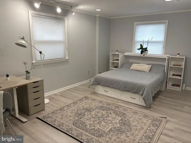 a bedroom with a bed and a dresser