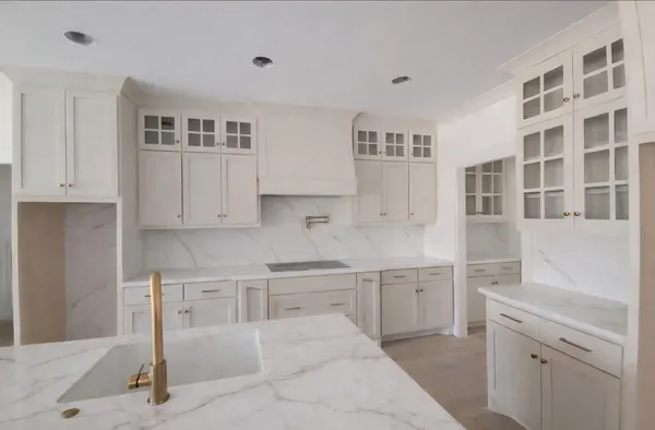 a kitchen with cabinets and window
