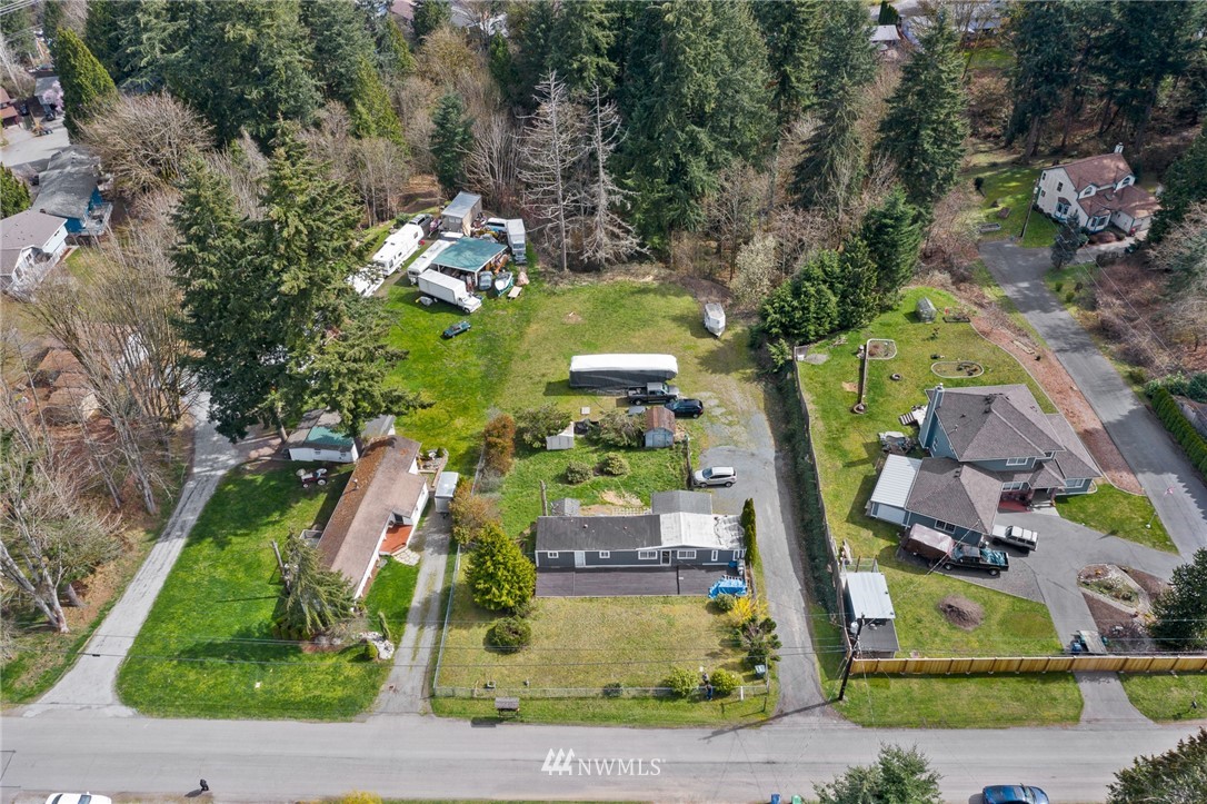 21325 Meridian Drive Southeast Bothell, WA 98021 - Photo 15 of 22 an aerial view of a house with a yard and a large tree