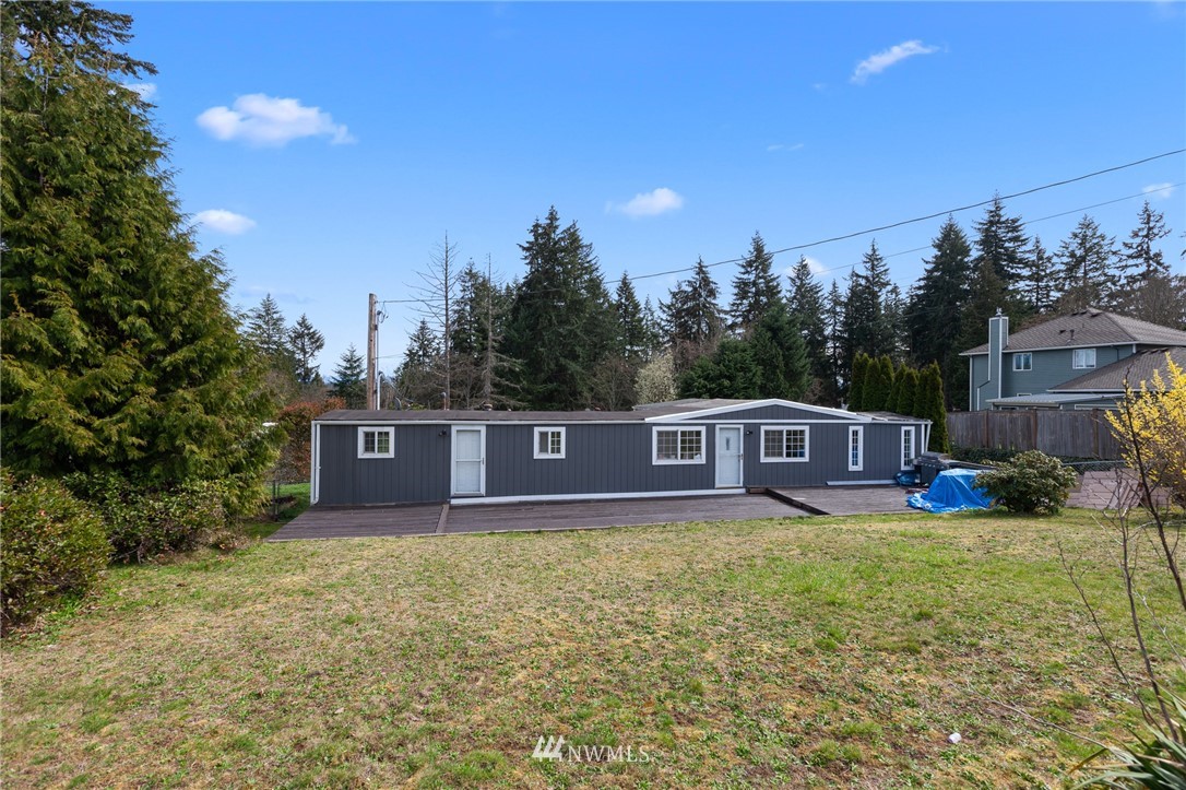 21325 Meridian Drive Southeast Bothell, WA 98021 - Photo 19 of 22 a view of a house with a yard and sitting area