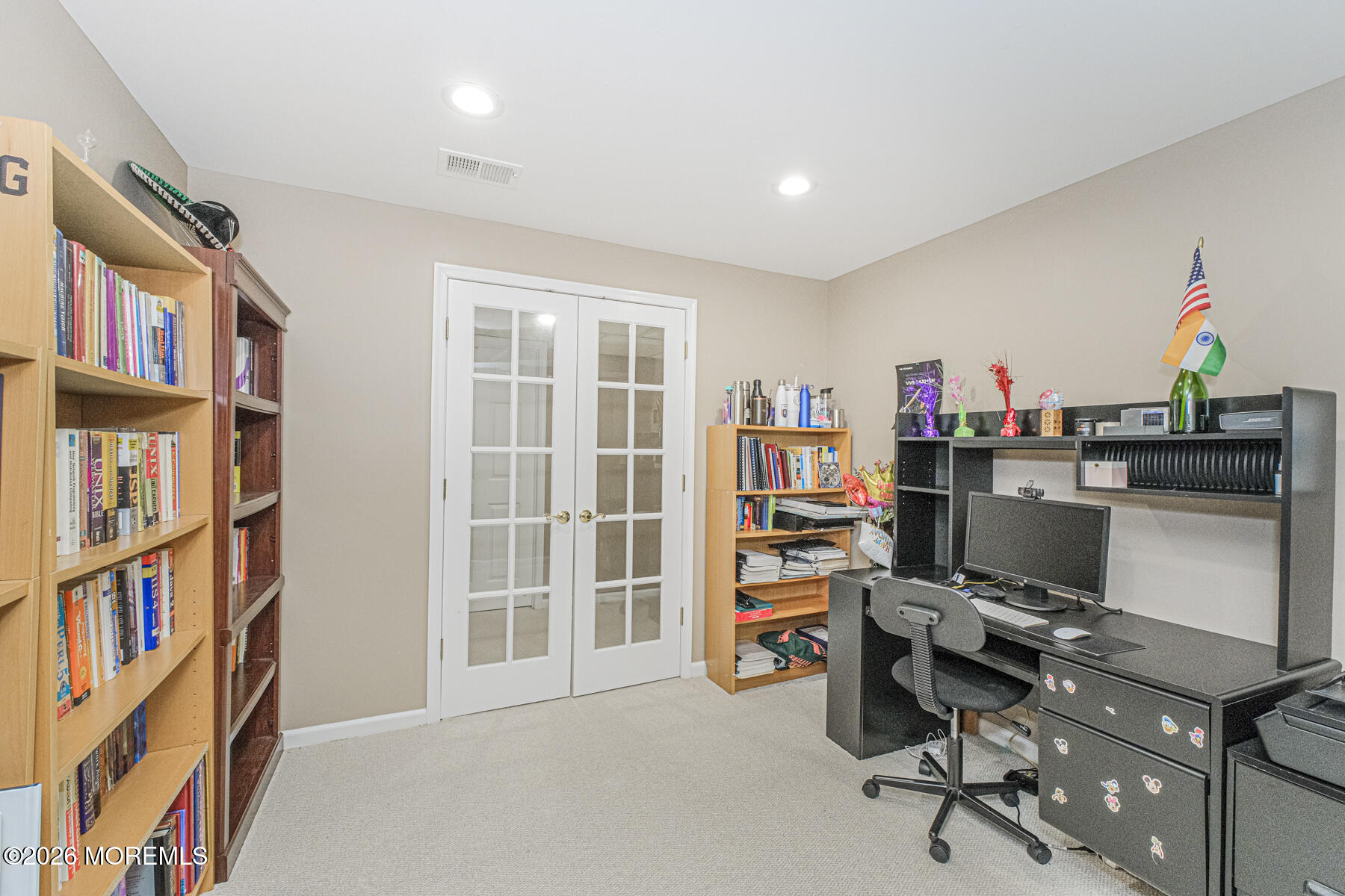 315 Wedgewood Road Morganville, NJ 07751 - Photo 24 of 37 a view of a workspace with furniture and a bookshelf