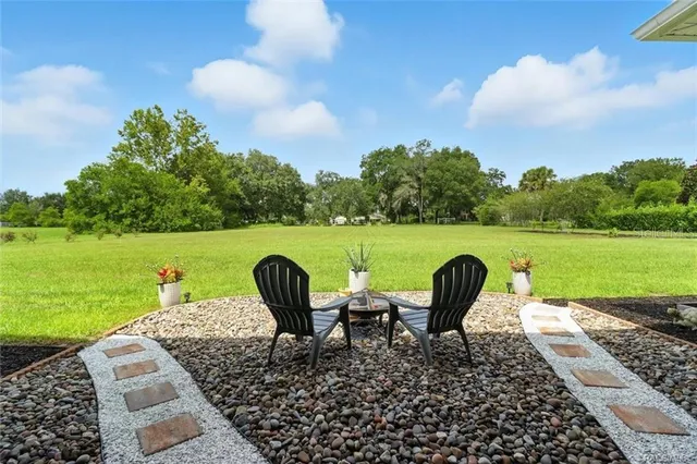 a front view of a house with a garden and porch