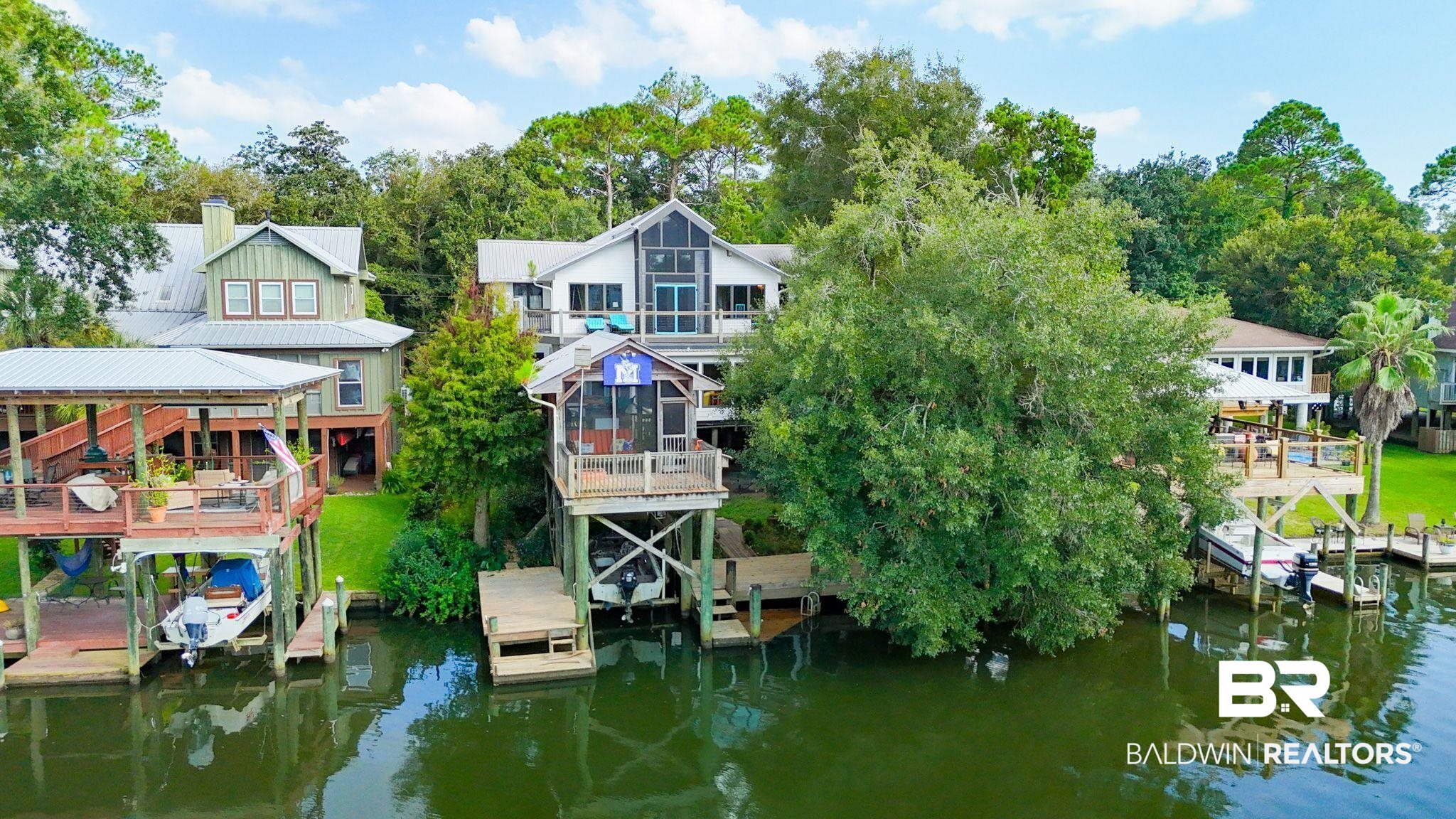 16451 Honey Road Summerdale, AL 36580 - Photo 55 of 55 Dock area with a water view, boat lift, view of scattered trees, and a gazebo