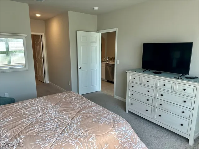 a bathroom with a sink mirror and shower