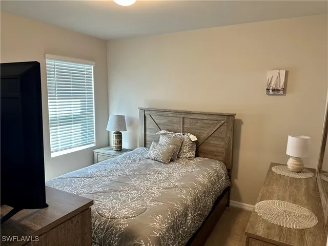 a bathroom with a sink toilet and a mirror