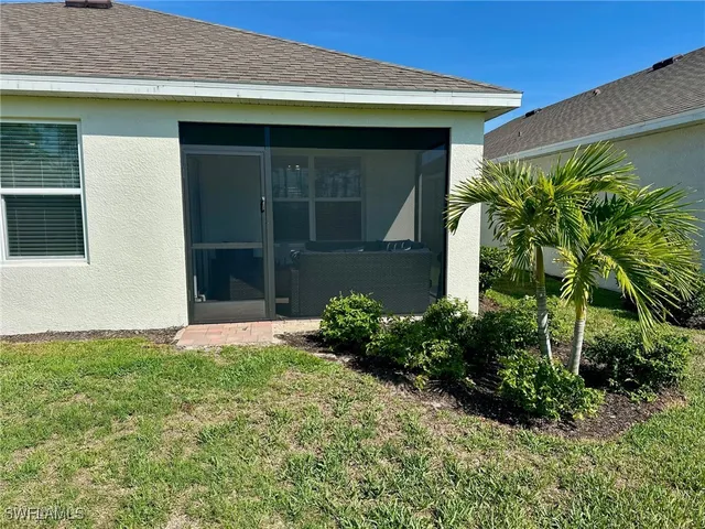 a view of a large garden with a building in the background