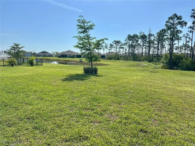 a view of a swimming pool with outdoor seating