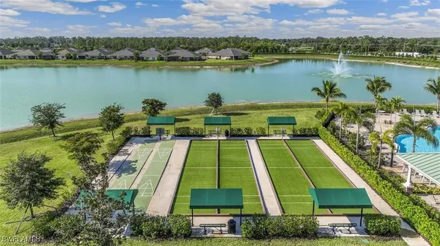 a view of a garden with a lake and mountain view