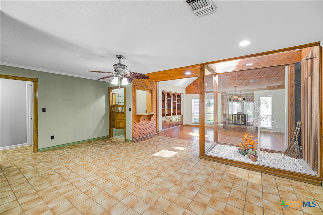 20 Hambleton Road Victoria, TX 77905 - Photo 11 of 48 a view of a hallway with a chandelier