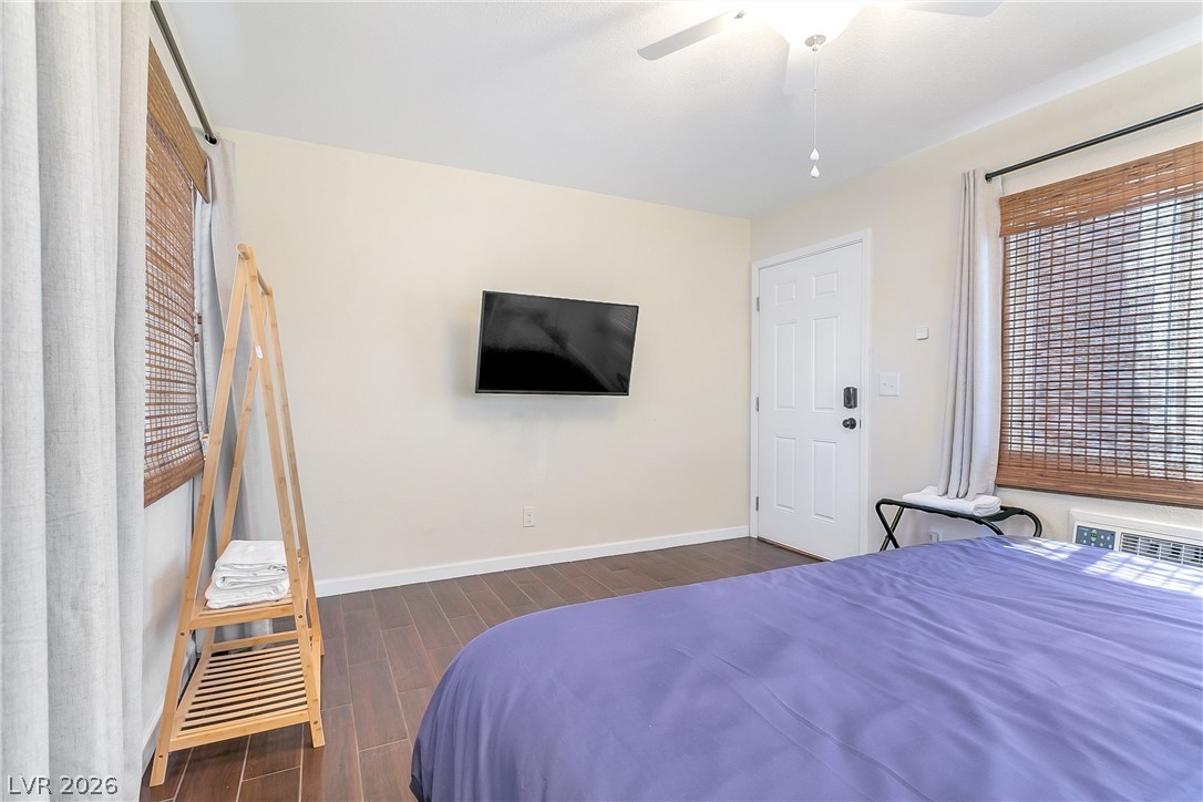 101 Beaver Ridge Avenue North Las Vegas, NV 89031 - Photo 19 of 42 Wood plank flooring and a private entrance distinguish this cozy bedroom space.