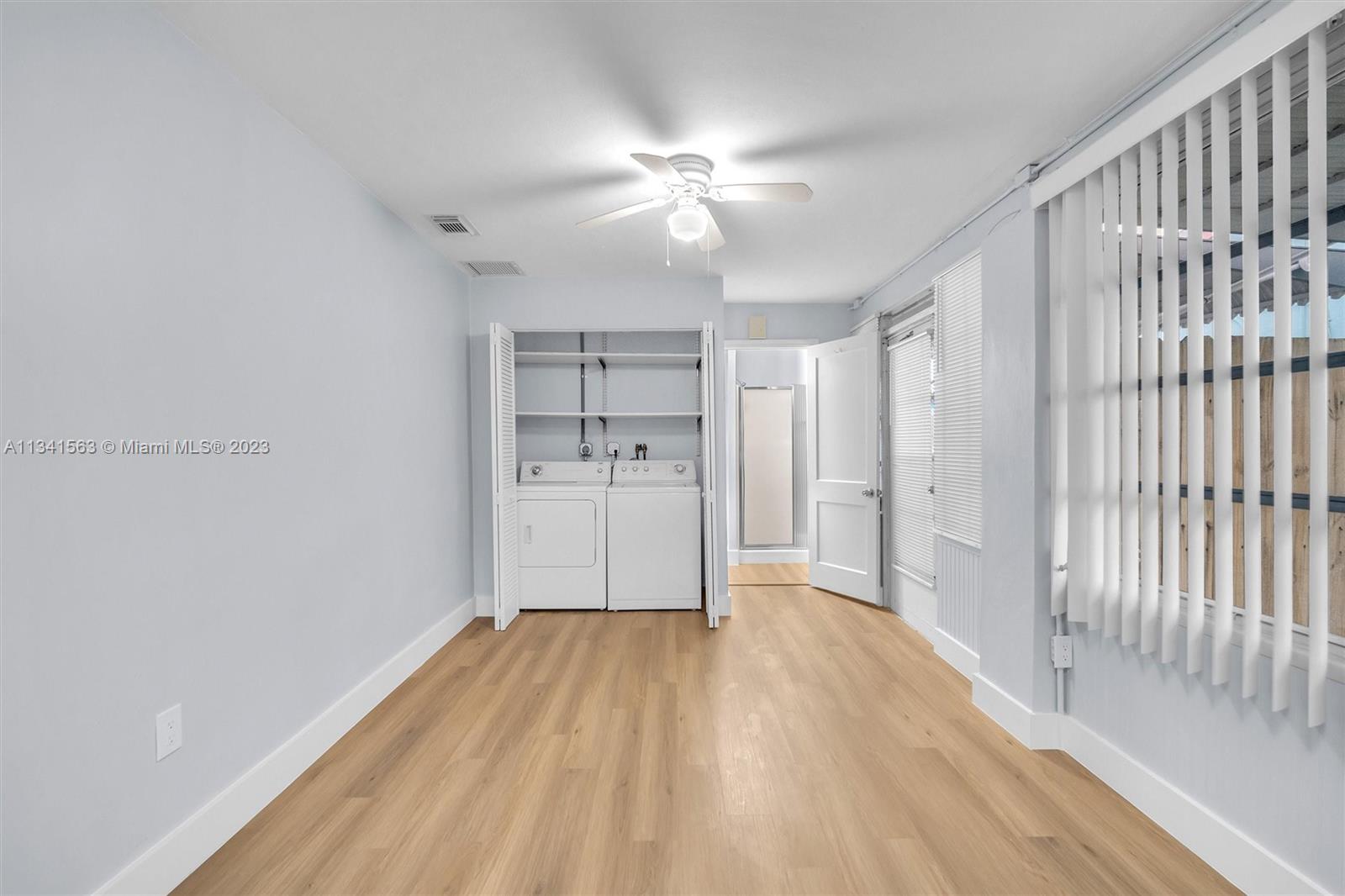 217 East 24th Street Riviera Beach, FL 33404 - Photo 14 of 27 a view of a livingroom with wooden floor