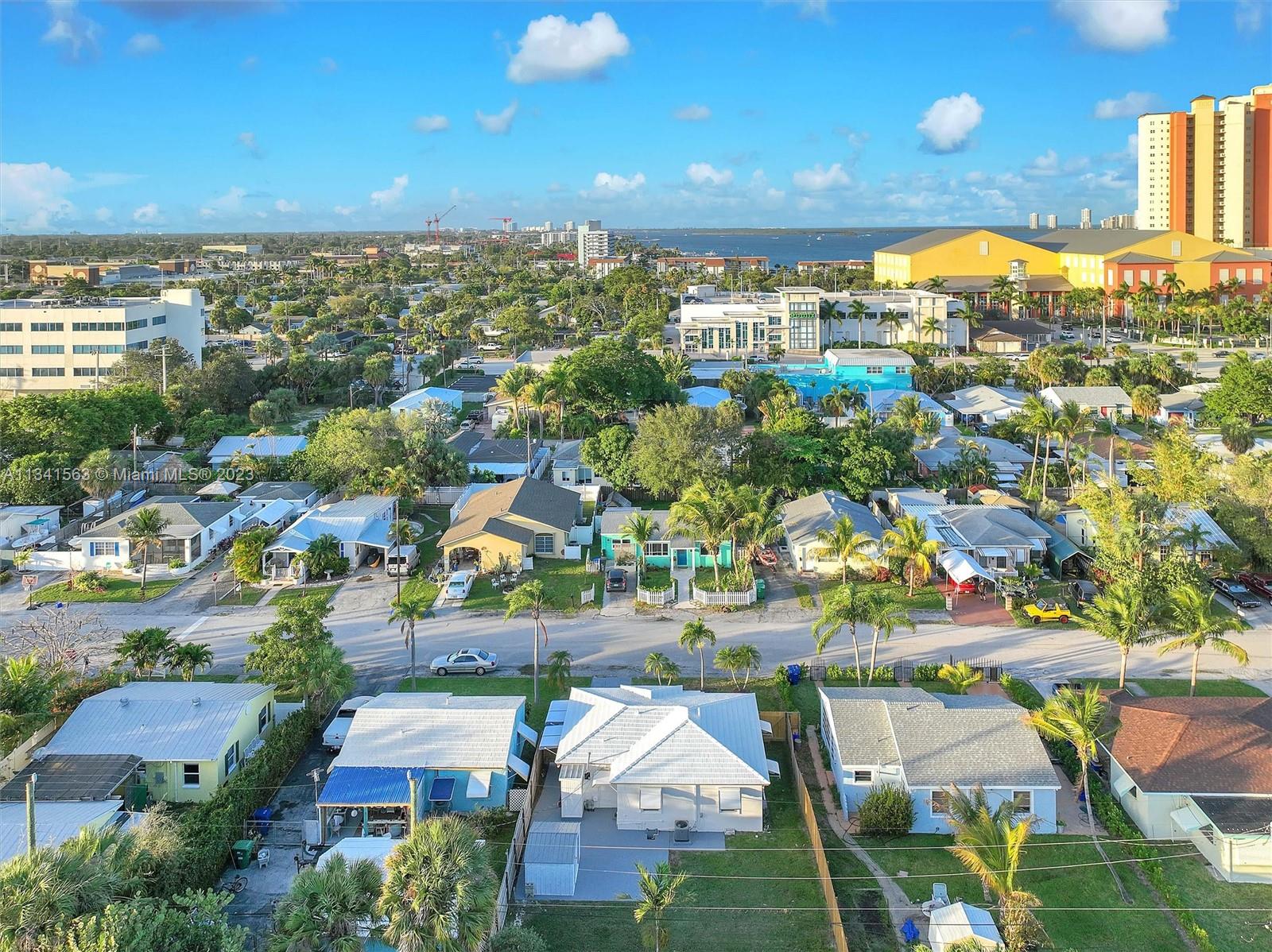 217 East 24th Street Riviera Beach, FL 33404 - Photo 22 of 27 an aerial view of residential houses with outdoor space and swimming pool