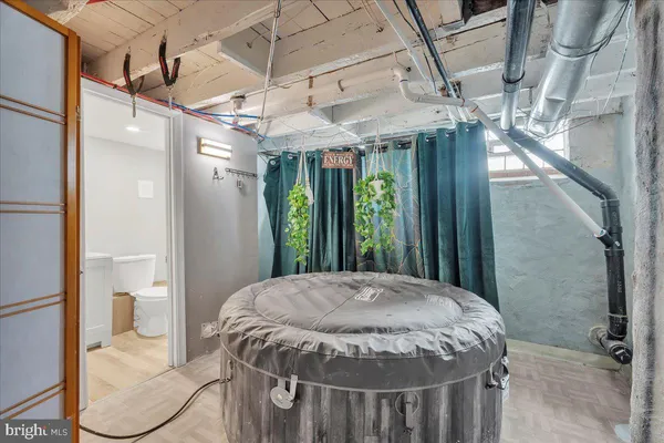 a bed sitting in a room next to a window