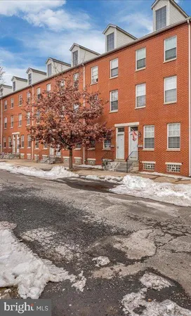 a front view of a building with street view