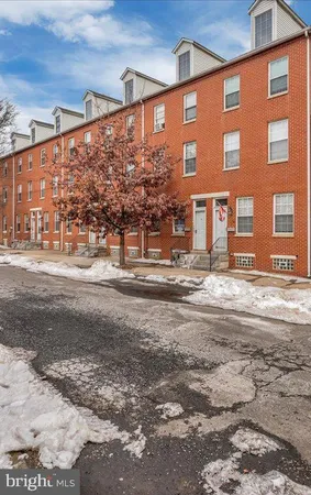 a front view of a building with a street
