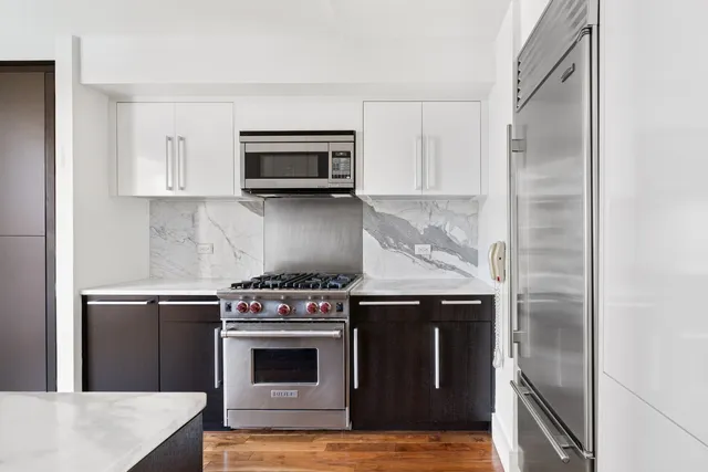 a kitchen with a stove and a microwave