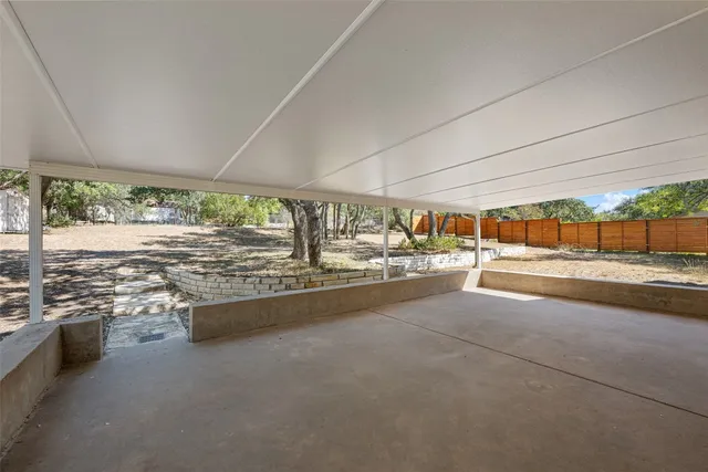 a view of a living room and floor to ceiling window