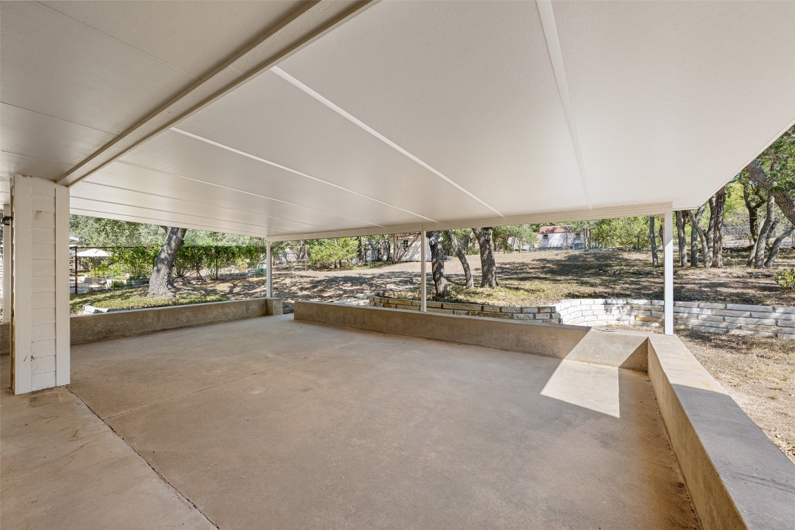 9424 El Rey Boulevard Austin, TX 78737 - Photo 23 of 35 a view of a living room and floor to ceiling window